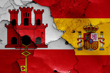 flags of Gibraltar and Spain painted on cracked wall