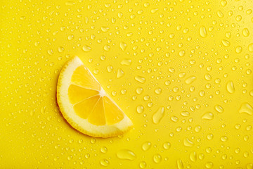 Lemon slice on yellow background