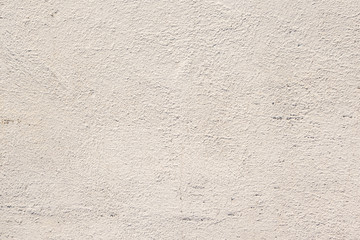abstract background of an old concrete wall painted in white close up