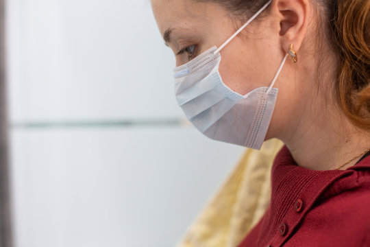 A Woman Coughing In Fits Is Sick With A Coronavirus Viral Infection That Spreads Coronavirus Without Covering Her Mouth And Nose. A Woman In A Medical Mask