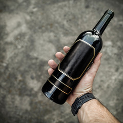 Wine of bottle and hand.Free space for your decoration. 