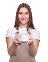 Young woman in apron with cup isolated on white background