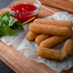 Delicious mozzarella/cheese sticks with ketchup
