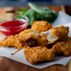 Crispy chicken strips with ketchup