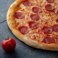 Tasty pepperoni pizza over a rustic background