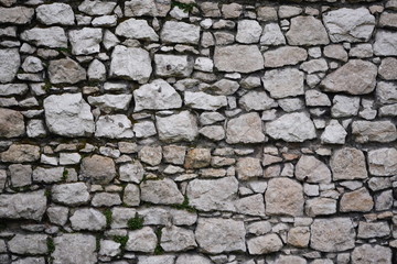 Stone wall, large gray stones, civil and industrial construction