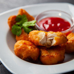 Crispy chicken nuggets with ketchup