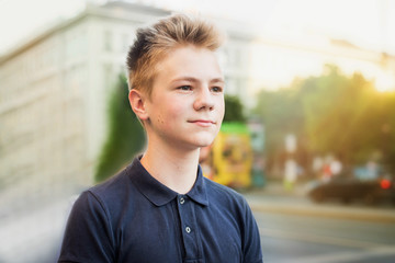 Fototapeta premium Portrait of a beautiful teenage boy. Close up photo. Young student have fun. Lifestyle photo.
