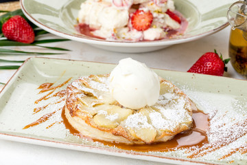 Charlotte dessert with ice cream sprinkled with skharny powder