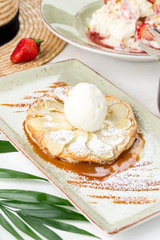 Charlotte dessert with ice cream sprinkled with skharny powder