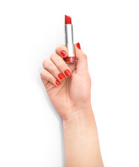 Hand with red manicure with red lipstick in hands isolated on white background