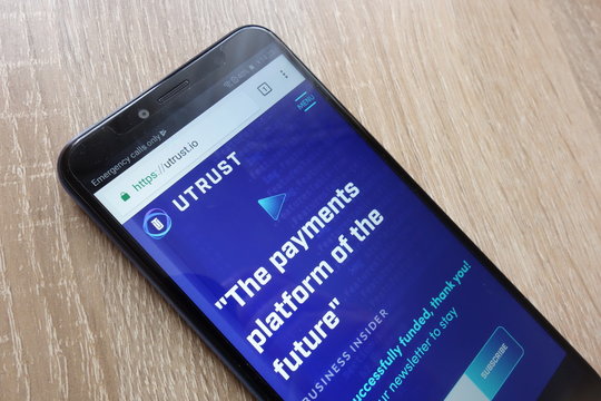 KONSKIE, POLAND - JULY 14, 2018: UTRUST (UTK) cryptocurrency website displayed on a modern smartphone