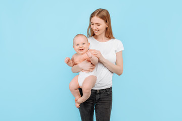 Happy family. young attractive mother with her adorable newborn son having fun