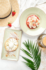 Dessert with strawberries and pear pie shot from above