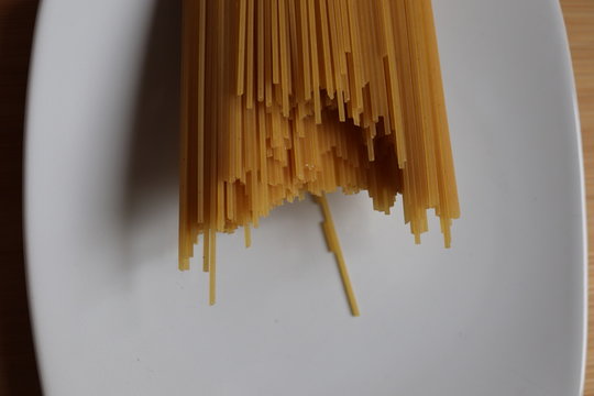 Pasta Spaghetti Strands On A White Plate