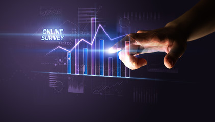 Hand touching ONLINE SURVEY button, business concept