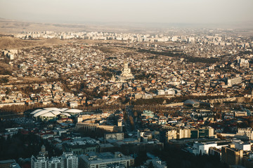 Beautiful aerial view of Tbilisi architecture in Georgia at sunset.