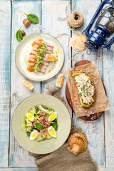 Several dishes in one photo salad, sandwich, sliced