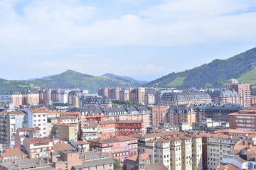 Fototapeta na wymiar Aerial view of Bilbao city with mounts at the background