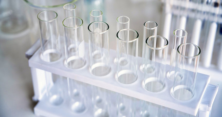 microscope with lab glassware, science laboratory research and development concept