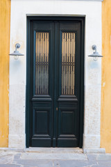 Old wooden carved door of a house