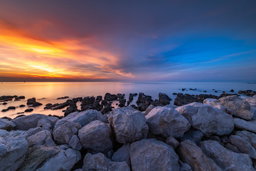 Fototapeta na wymiar Sunset beach Umag Croatia sea clouds