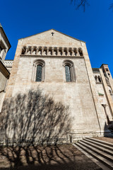 Fototapeta na wymiar Closeup of the San Vigilio Cathedral (Duomo di Trento, 1212-1321) in Romanesque and Gothic style, Trento downtown, Trentino-Alto Adige, Italy, Europe
