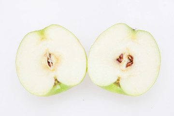 Closeup macro of two halves of a apple on the white