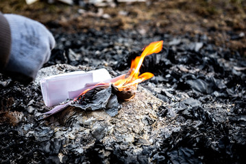 Lighting a fire with a gas can. Lighter with pistol with gas cartridge.