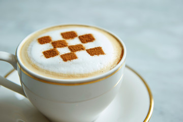 Latte art with checkered pattern 
