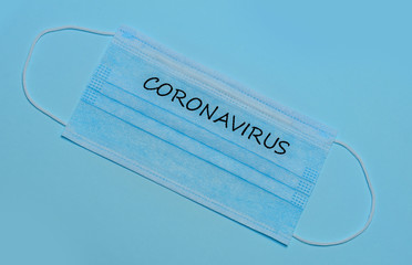 Surgical mask protective mask with CORONAVIRUS text. Chinese coronavirus outbreak.