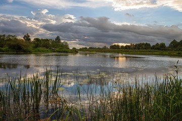cloudy clouds over the river in summer