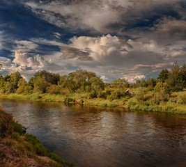 cloudy clouds over the river in summer