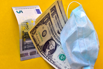 Cash bills dollars and euros protective medical mask