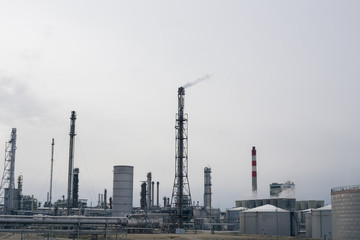 Fototapeta premium Large modern factory outside in the afternoon