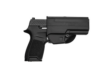 Modern black gun isolate on a white back. Weapons for the police and the army. A gun in a plastic holster.