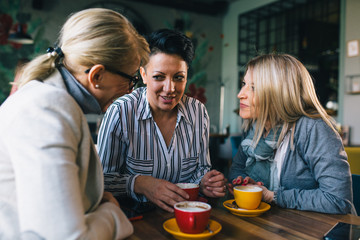 women friends at coffee break at cafe