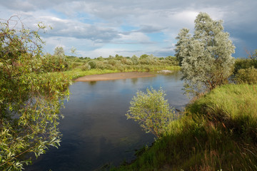 cloudy clouds over the river in summer