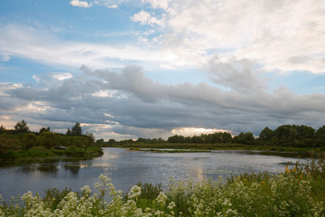 cloudy clouds over the river in summer