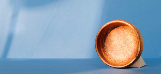wooden cup on a blue background
