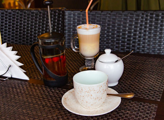coffee and tea on a table in a coffee shop