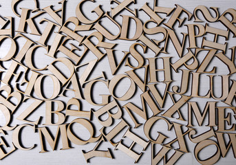 mixed wooden letters on a white background