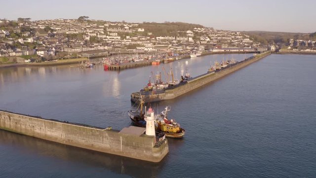Fishing Boat Returning to Port at Sunrise