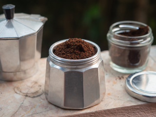 ground coffee in Moka pot.