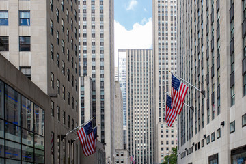 American flags with buildings at downtown Manhattan