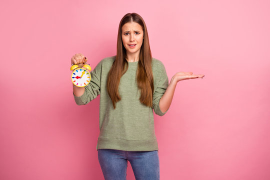 Portrait of upset sad girl hold clock disappoint her missed work business study meeting wear sweater isolated over pastel color background