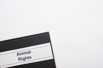 top view of black notebook with animals rights inscription on white background
