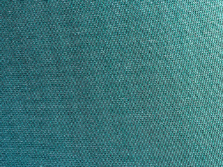 Green old grunged textile for the background.
