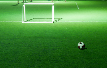 Football or Soccer Field with the Goal Post in the Night Time.