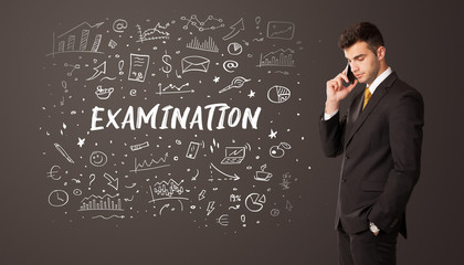 Businessman thinking with EXAMINATION inscription, business education concept